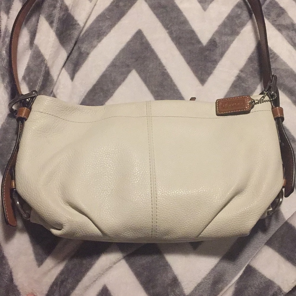 White and brown coach purse
